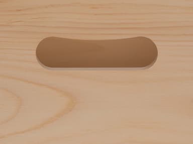 Ergo handle: a rounded hand-hold cut into the end of a pine wine box by Quintessential Canada Inc.