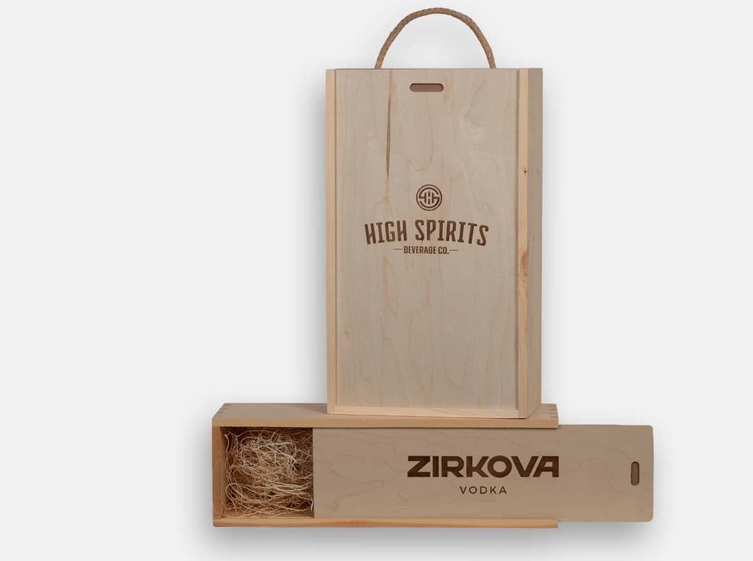 Natural pine sliding lid boxes for single or double bottle presentation. Jute handle and wood excelsior included. Wood imprint branding.