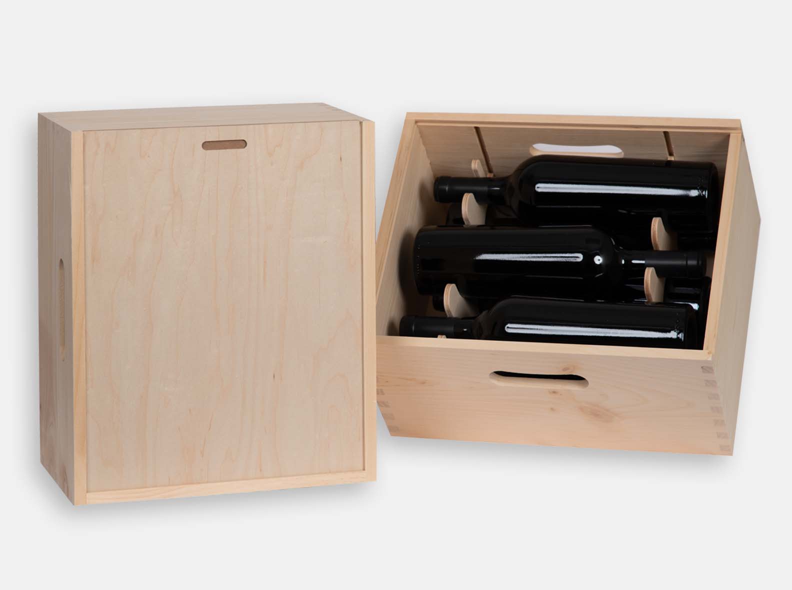 Wooden gift box with sliding lid for 6 wine bottles. Removable CNC yokes. Handles cut by CNC. Box joint construction. Wood imprint logo branding for corporate promotion. Made in Canada.