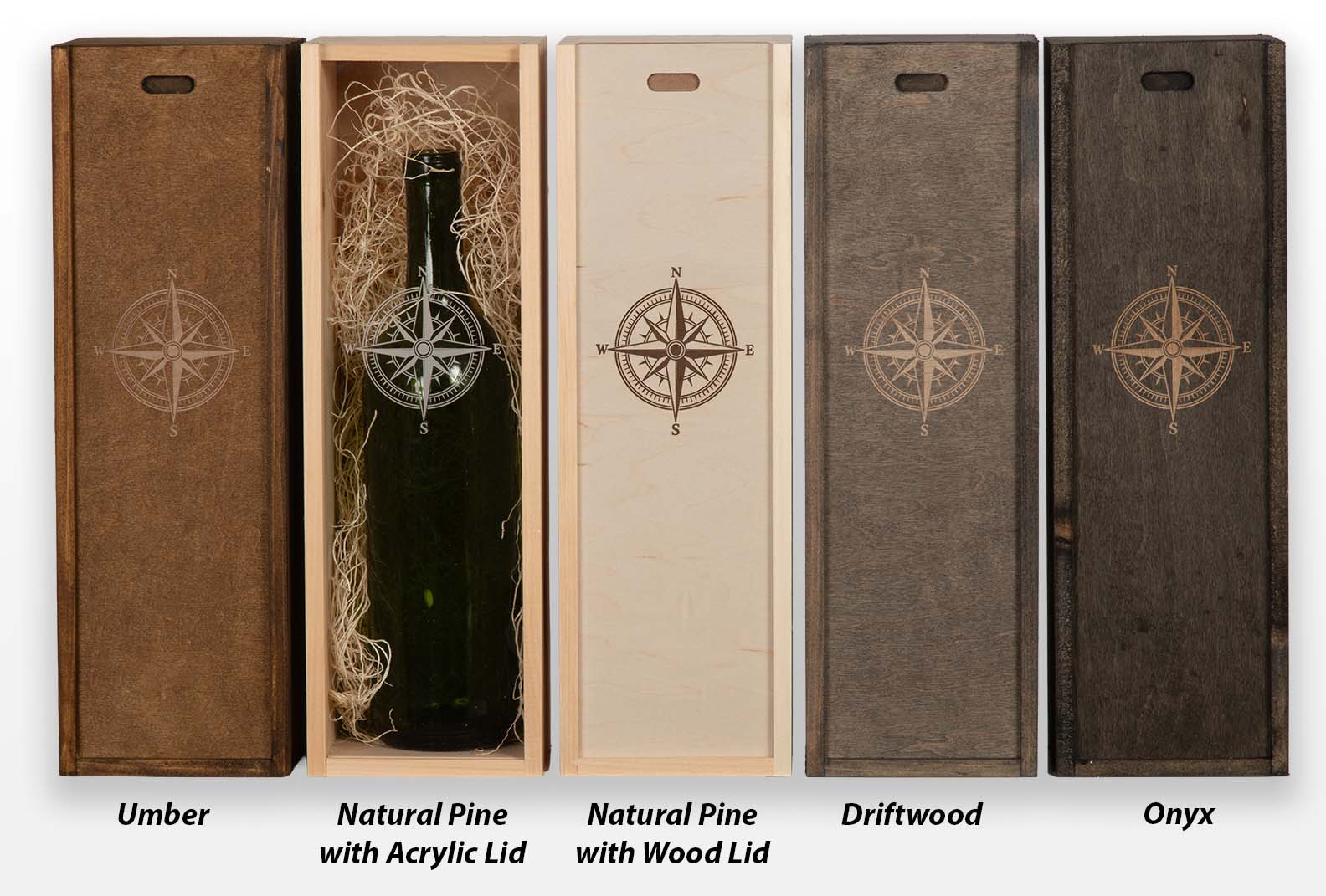 Five wood wine box stain options — Umber, Natural Pine with acrylic lid, Natural Pine with wood lid, Driftwood, and Onyx — each engraved with a compass rose.
