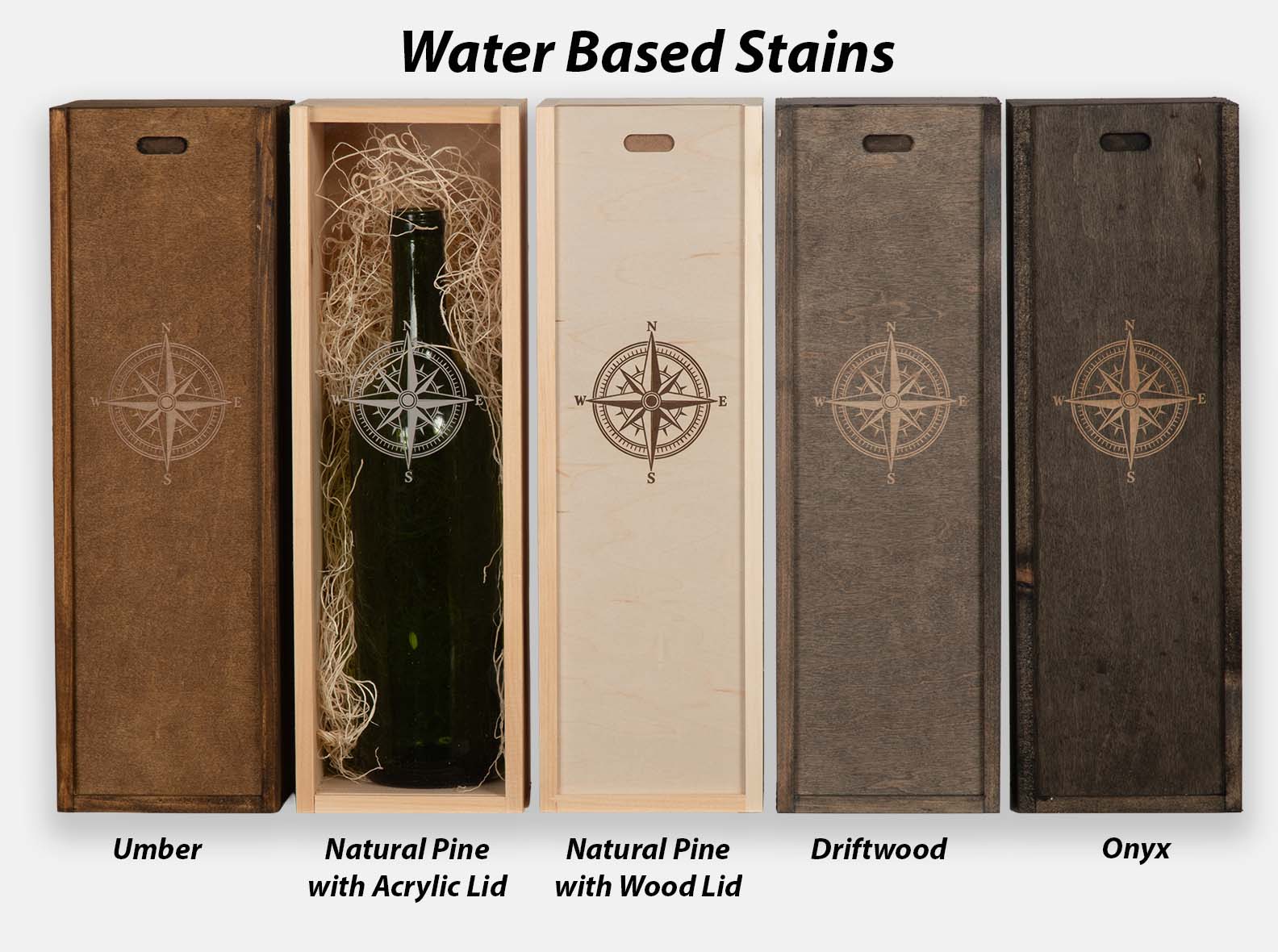 Five wood wine box stain options — Umber, Natural Pine with acrylic lid, Natural Pine with wood lid, Driftwood, and Onyx — each engraved with a compass rose.